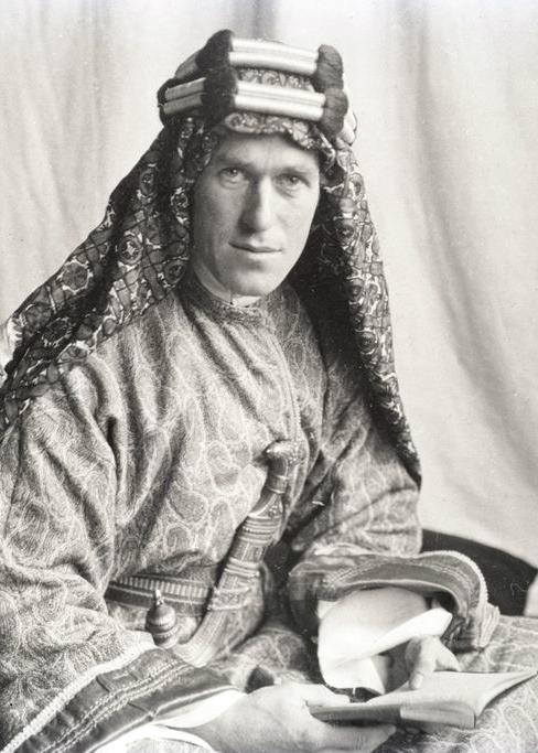 T.E. Lawrence holds Lowell Thomas's book "With Lawrence in Arabia," the work that later inspired the film "Lawrence of Arabia." (Public Domain)