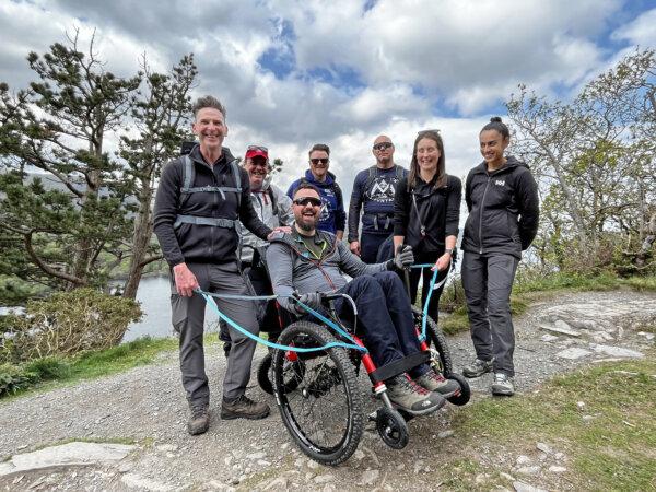 Undated image of Martin Hibbert (centre), who was paralysed in the Manchester Arena attack in 2017 but climbed Mount Kilimanjaro in Tanzania to raise money for charity. (Spinal Injuries Association.)