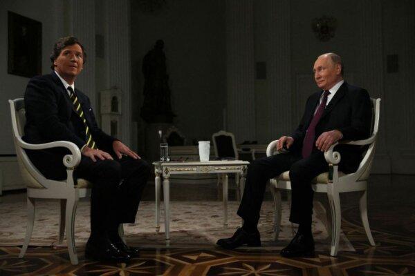 In this pool photograph distributed by Russian state agency Sputnik, Russia's President Vladimir Putin gives an interview to U.S. talk show host Tucker Carlson at the Kremlin in Moscow on Feb. 6, 2024. (Gavriil Grigorov/Pool/AFP)