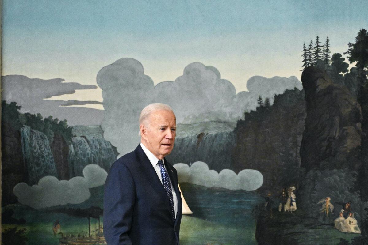 U.S. President Joe Biden comes back to answer questions about Israel after speaking about the special counsel report in a surprise last-minute addition to his schedule for the day in the Diplomatic Reception Room of the White House on Feb. 8, 2024. (Mandel Ngan/AFP via Getty Images)