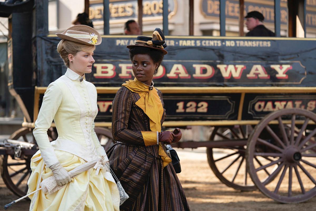 "The Gilded Age," Julian Fellowes's story of American aristocracy, incorporates multiple story lines across racial boundaries. Here, Marian Brook (Louisa Jacobson, L) and Peggy Scott (Denée Benton) walk together. (Courtesy of HBO)