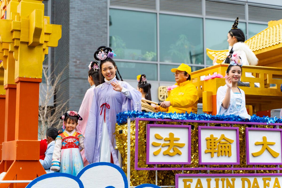 Falun Gong practitioners attend a parade celebrating the Chinese New Year, in the Flushing neighborhood of Queens, N.Y., on Feb. 10, 2024. (Chung I Ho/The Epoch Times)