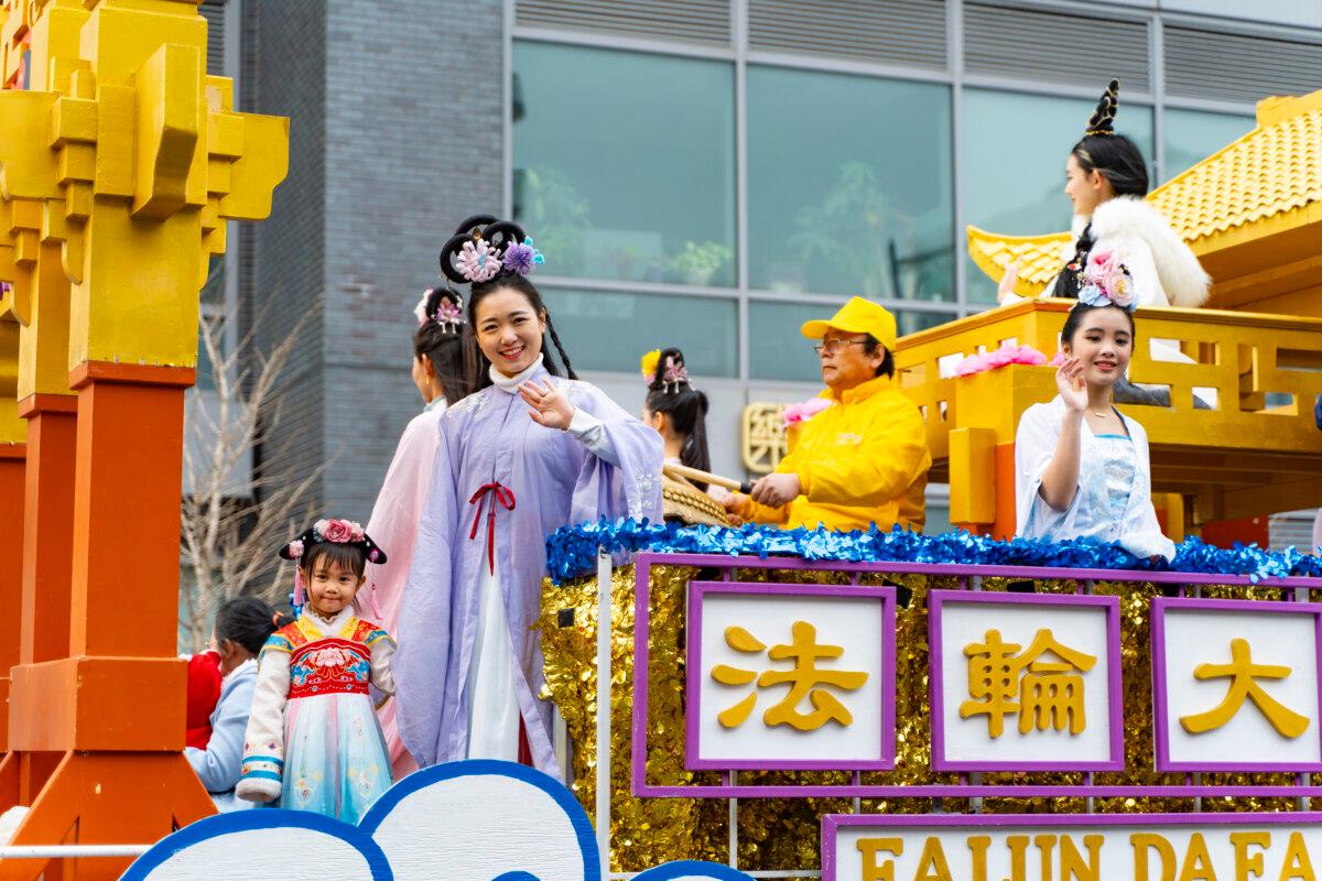 Falun Gong practitioners attend a parade celebrating the Chinese New Year in the Flushing neighborhood of Queens, N.Y., on Feb. 10, 2024. (Chung I Ho/The Epoch Times)