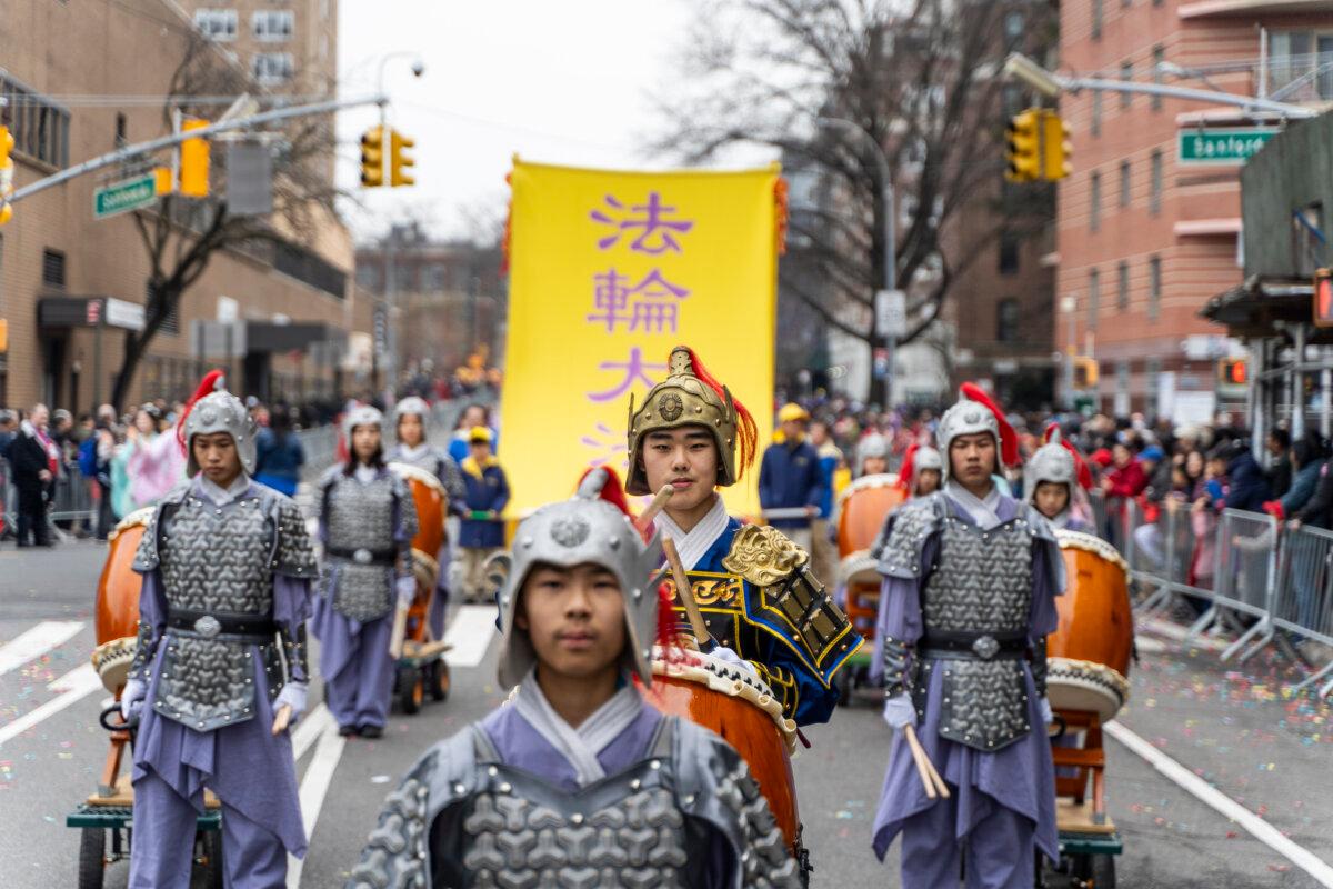 Falun Gong practitioners attend a parade celebrating the Chinese New Year in the Flushing neighborhood of Queens, N.Y., on Feb. 10, 2024. (Chung I Ho/The Epoch Times)