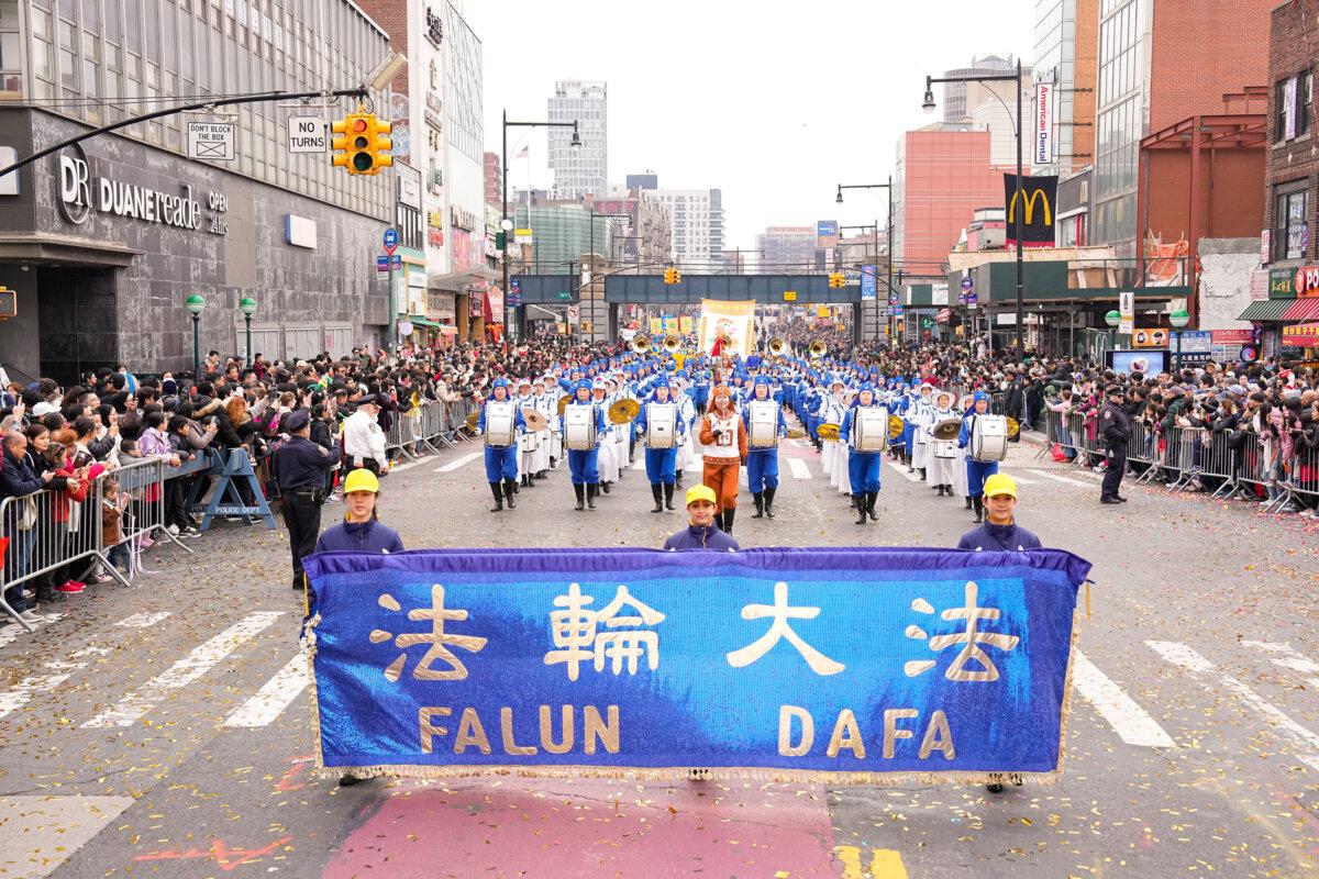 Falun Gong practitioners attend a parade celebrating the Chinese New Year, in the Flushing neighborhood of Queens, N.Y., on Feb. 10, 2024. (Larry Dye/The Epoch Times)