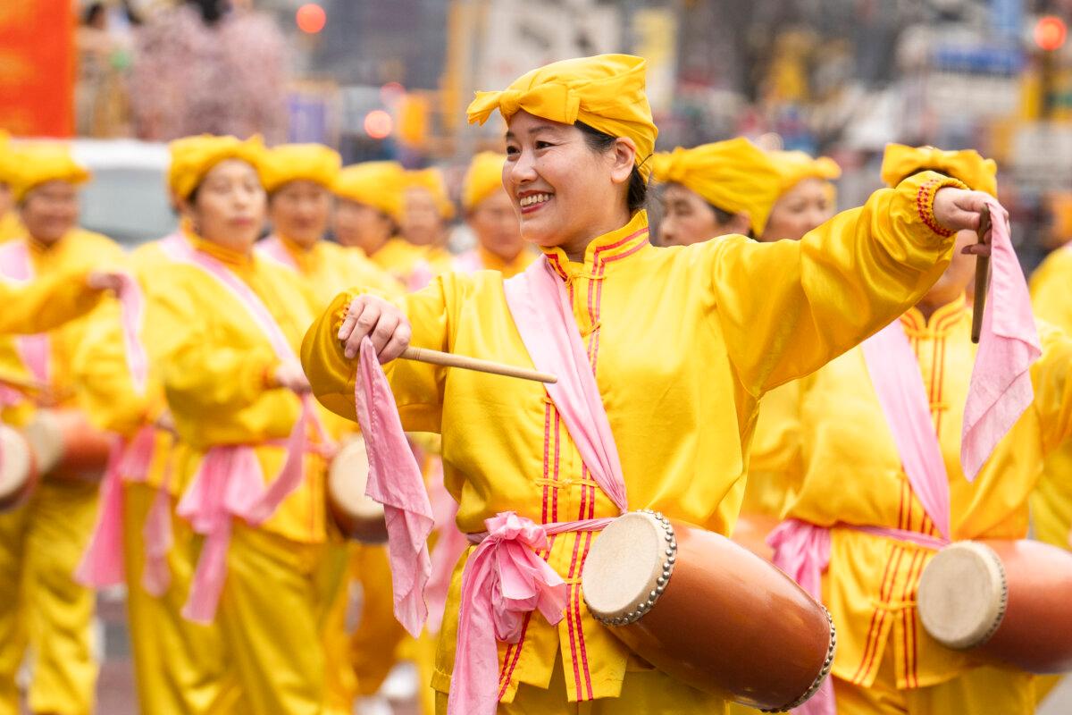 Falun Gong practitioners attend a parade celebrating the Chinese New Year, in the Flushing neighborhood of Queens, N.Y., on Feb. 10, 2024. (Samira Bouaou/The Epoch Times)