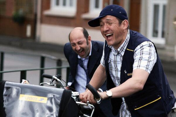 Philippe Abrams (Kad Merad, L) laughs it up with Antoine Bailleul (Dany Boon), in “Welcome to the Sticks.” (Pathé)