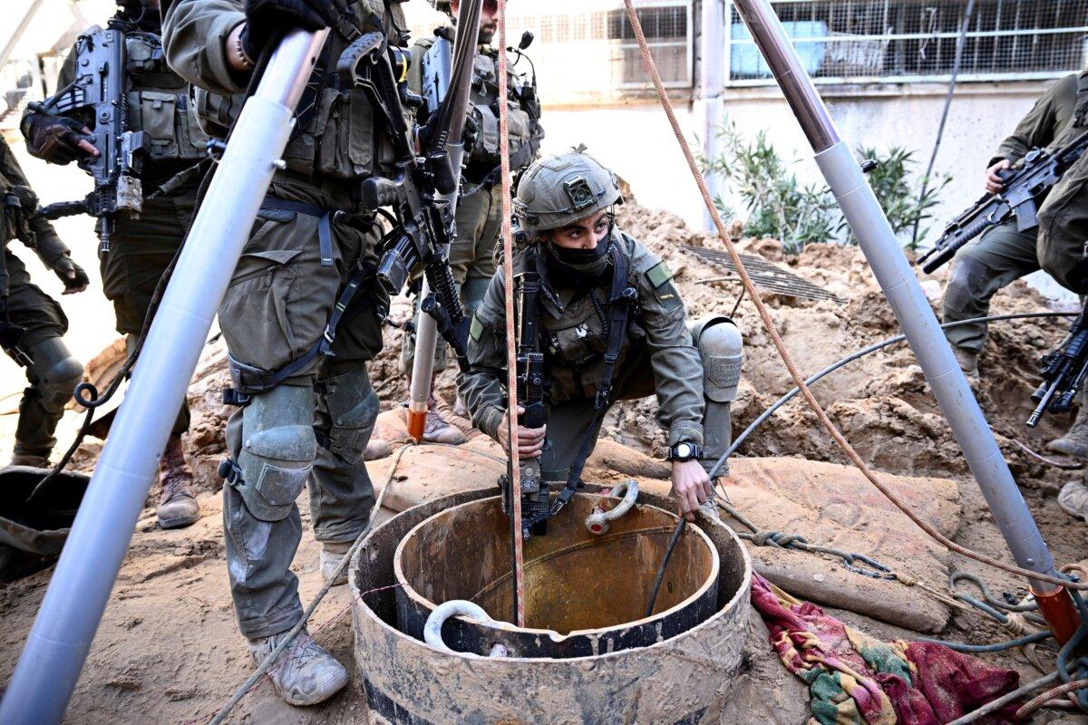 Israeli soldiers use a camera to inspect what the military described as a Hamas command tunnel running partly under UNRWA headquarters in the Gaza Strip on Feb. 8, 2024. (Dylan Martinez/Reuters)