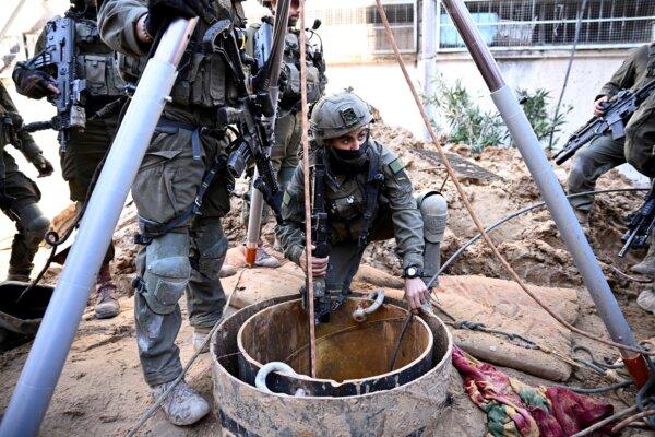 Israeli soldiers use a camera to inspect what the military described as a Hamas command tunnel running partly under UNRWA headquarters in the Gaza Strip, on Feb. 8, 2024. (Dylan Martinez/Reuters)