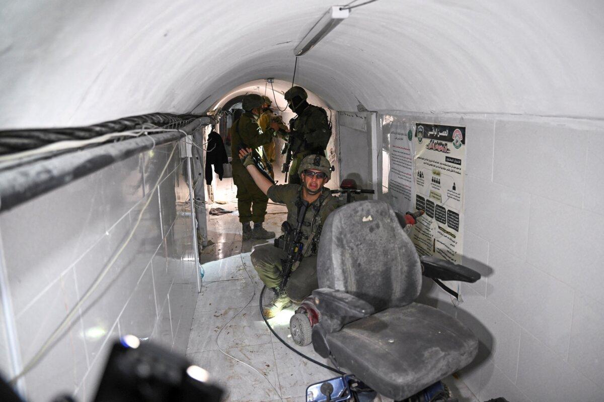 An Israeli soldier gestures in what the military described as a Hamas command tunnel running partly under UNRWA headquarters in the Gaza Strip on Feb. 8, 2024. (Dylan Martinez/Reuters)