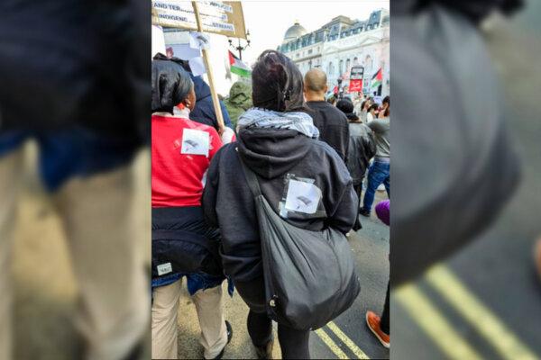 A screen grab of video footage of Pauline Ankunda (L) and Heba Alhayek (R) wearing images of paragliders during a pro-Palestinian rally in central London, on Oct. 14, 2023. (Metropolitan Police)