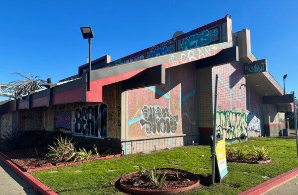A Denny's restaurant is seen covered by graffiti shortly after the location is closed due to safety concerns in Oakland, Calif., on Feb. 10, 2024. (David Zhang/NTD Television)