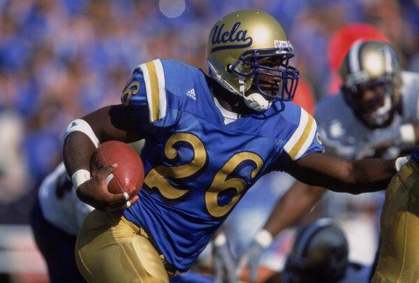 DeShaun Foster, formerly of the University of California Los Angeles (UCLA) Bruins, runs for a 94-yard touchdown against the Washington Huskies at the Rose Bowl in Pasadena, Calif., on Oct. 13, 2001. (Stephen Dunn/Allsport via Getty Images)