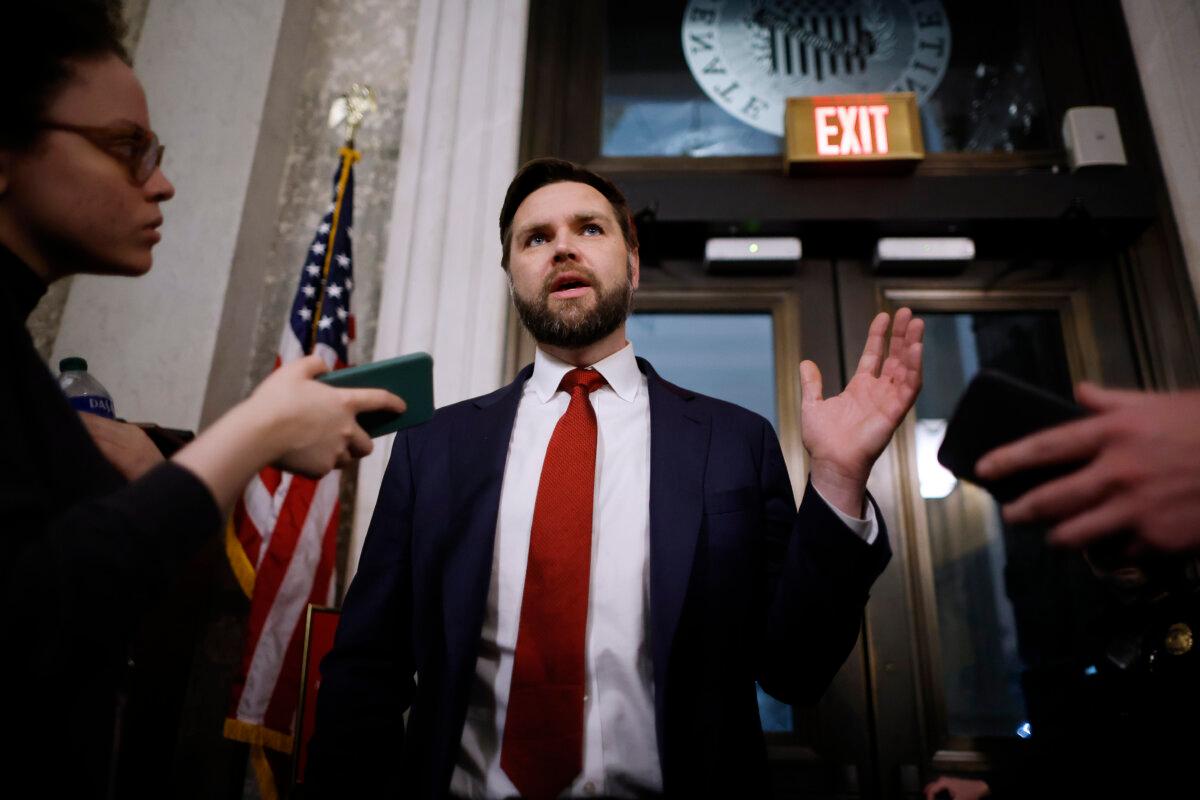 Sen. J.D. Vance (R-Ohio) (C) talks to reporters between votes at the U.S. Capitol in Washington on Feb. 12, 2024. (Chip Somodevilla/Getty Images)