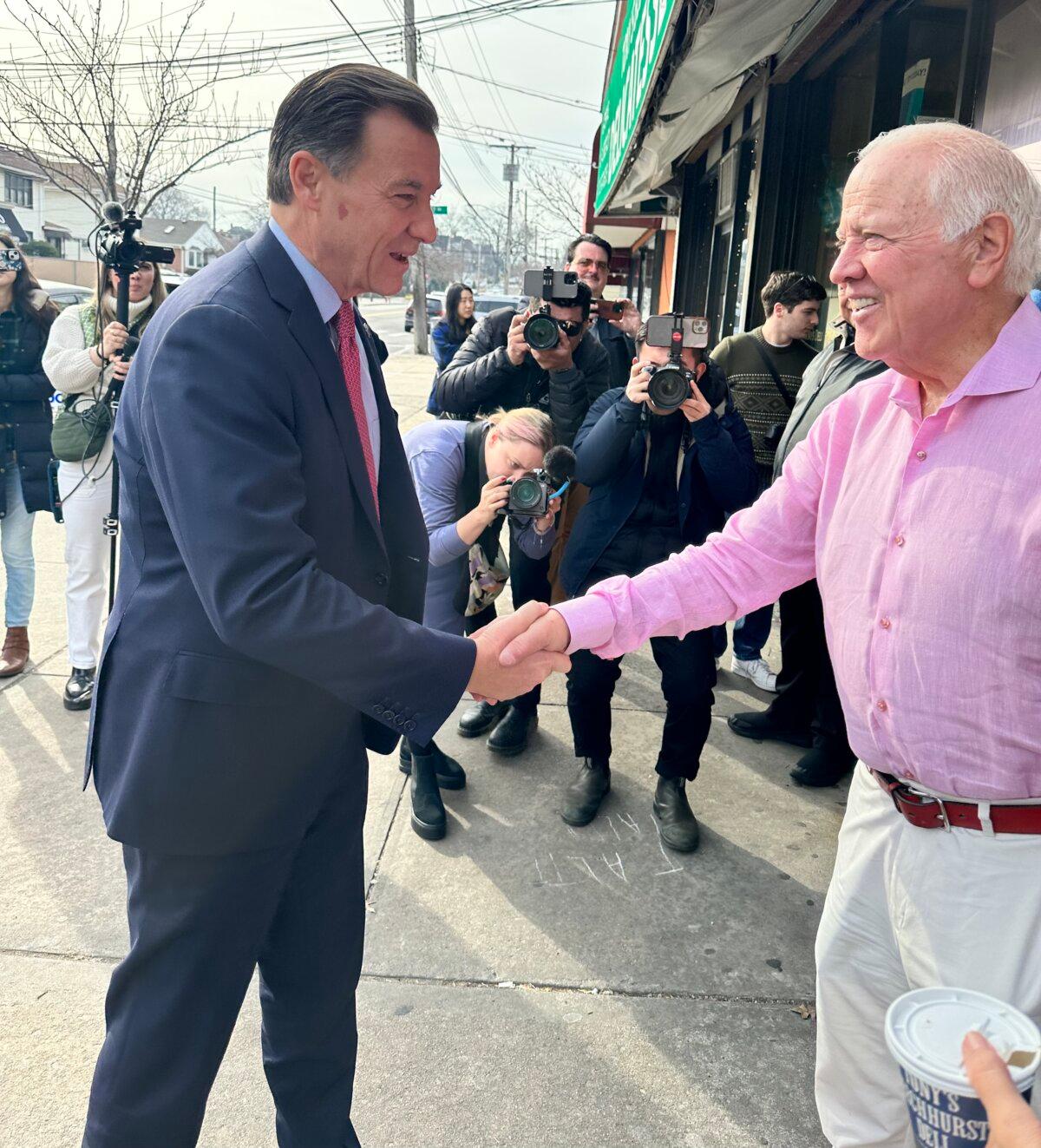 Democrat candidate Tom Suozzi greets a supporter in front of Tony's Beechurst Deli in Whitestone, Queens, on Feb. 10, 2024. (Courtesy of Juliette Fairley)