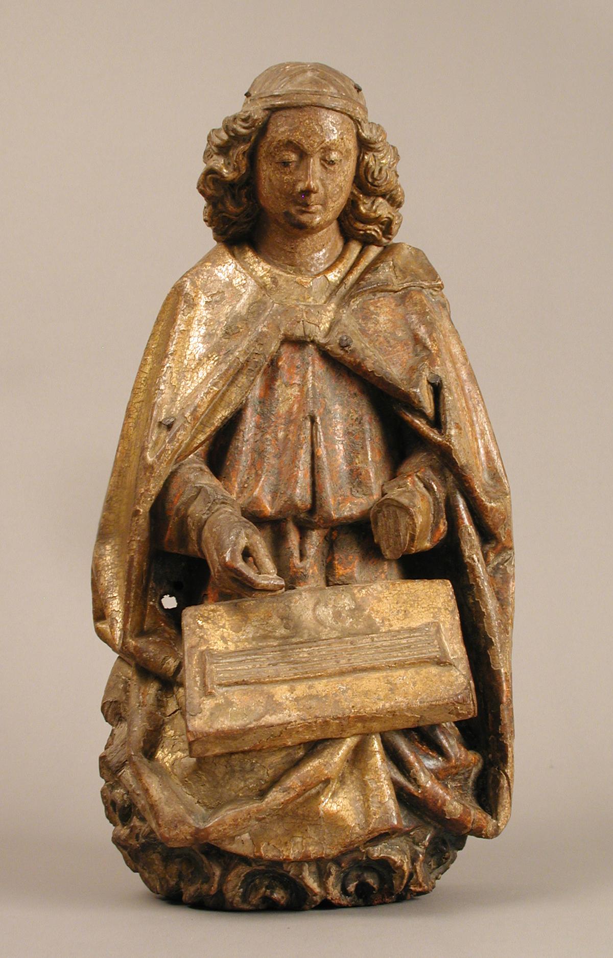 An angel playing a dulcimer, circa 1460–1480, from the Rhine Valley. Gilded and painted wood. The Metropolitan Museum of Art, New York City. (Public Domain)