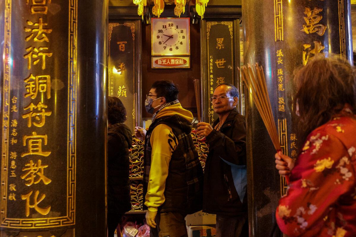 Worshippers queue up to offer the first joss sticks at a temple in Keelung, Taiwan, on Feb. 10, 2024, on the first day of the Lunar New Year of the Dragon. (I-Hwa Cheng/AFP via Getty Images)