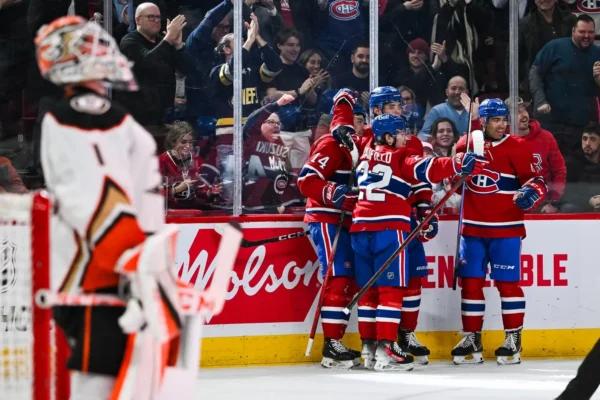 Montreal Canadians center Nick Suzuki (14) celebrates his first goal of the game against the Anaheim Ducks with his teammates during the second period at Bell Centre in Montreal, Canada, on Feb. 13, 2024. (David Kirouac/USA TODAY Sports via Field Level Media)