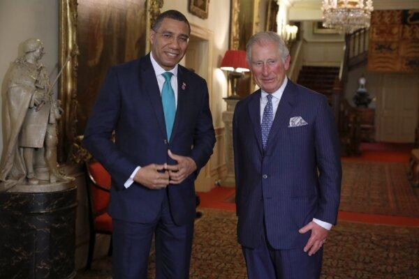 Then Prince Charles (R) greets the prime minister of Jamaica, Andrew Holness (L) at Clarence House in London on April 17, 2018. (Dan Kitwood—WPA Pool/Getty Images)
