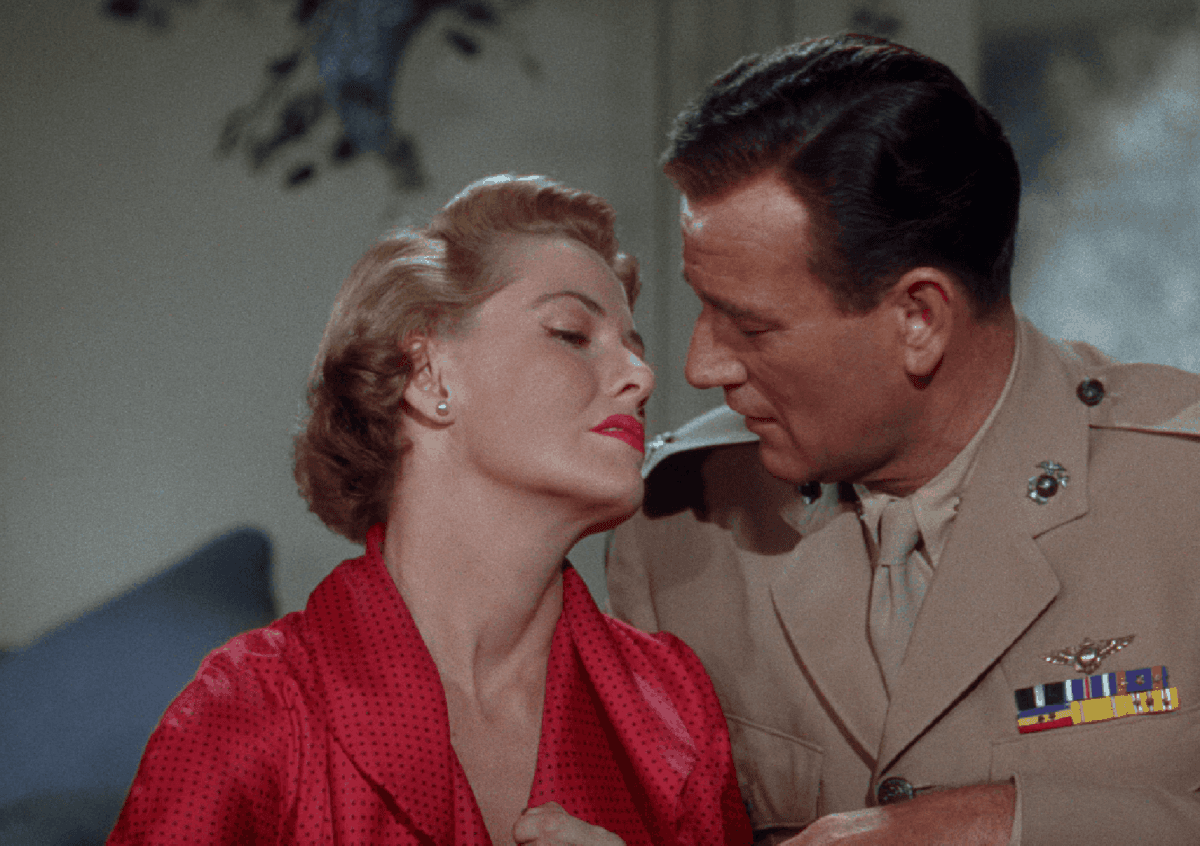 Maj. Dan Kirby (John Wayne) with his wife Joan (Janis Carter), in “The Flying Leathernecks.” (RKO Radio Pictures)