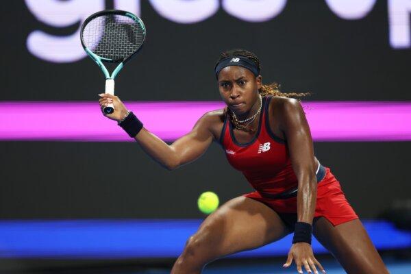 Coco Gauff of the United States plays a forehand against Katerina Siniakova of the Czech Republic in their women's singles 2nd round match during the Hologic WTA Tour at Khalifa International Tennis and Squash Complex in Doha, Qatar, on Feb. 13, 2024. (Clive Brunskill/Getty Images)