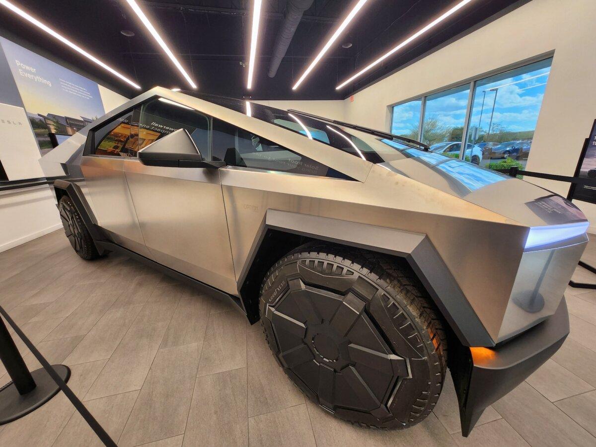 A 2024 Tesla all-wheel-drive vehicle sits in the display room at a Tesla dealership in Phoenix, Ariz., on Feb. 1, 2024. The truck sells for $100,000. (Allan Stein/The Epoch Times).