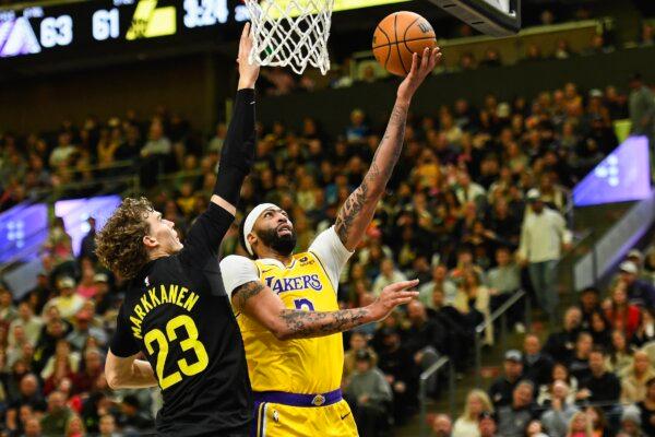 Anthony Davis (3) of the Los Angeles Lakers shoots over Lauri Markkanen (23) of the Utah Jazz during the first half of a game in Salt Lake City on Feb. 14, 2024. (Alex Goodlett/Getty Images)