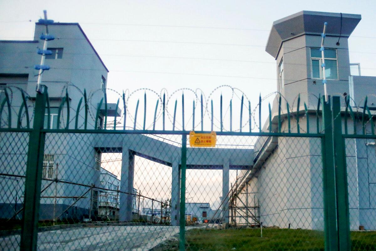 A perimeter fence around what is officially known as a vocational skills education center in Dabancheng, in the Xinjiang Uyghur region of China, on Sept. 4, 2018. (Thomas Peter/Reuters)