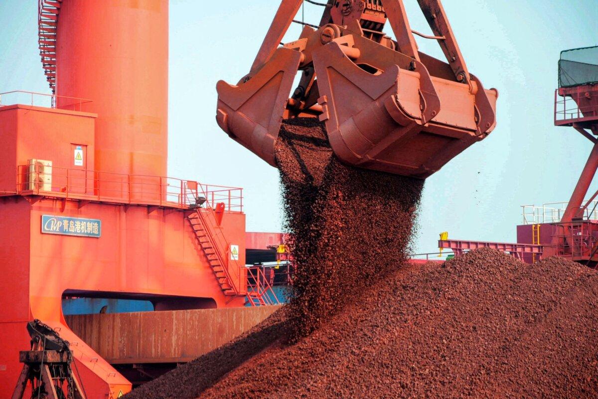 Imported iron ore being unloaded at a port in Qingdao in eastern China's Shandong Province on Oct. 20, 2019. (STR/AFP via Getty Images)