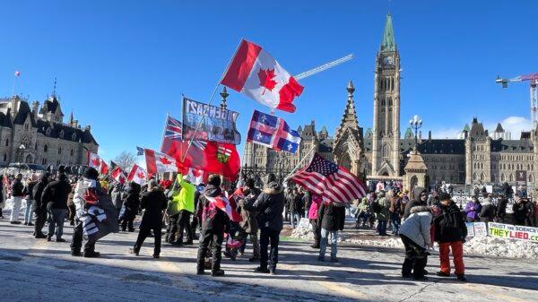 Protesters gather on Parliament Hill in Ottawa to mark the two-year anniversary of Freedom Convoy on Feb. 17, 2024. (Annie Wu/NTD)