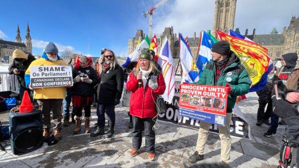 Protesters gather on Parliament Hill in Ottawa to mark the two-year anniversary of Freedom Convoy on Feb. 17, 2024. (Annie Wu/NTD)