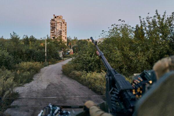 A Ukrainian soldier sits in his position in Avdiivka, in the Donetsk region of Ukraine, on Aug. 18, 2023. (Libkos/AP Photo)