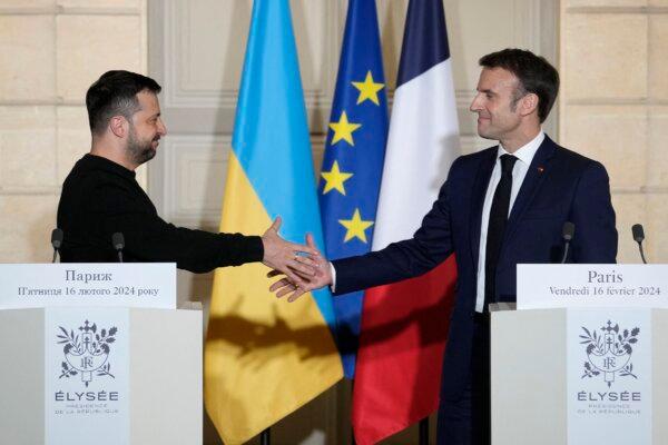 France's President Emmanuel Macron and Ukraine's President Volodymyr Zelenskyy at a press conference after signing a bilateral security agreement, at the presidential Elysee Palace in Paris on Feb. 16, 2024. (Thibault Camus/Pool/AFP via Getty Images)