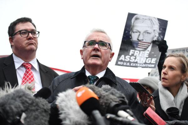 Australian politicians George Christensen (L) and Andrew Wilkie (C) hold a press conference at Belmarsh Prison on Feb. 18, 2020 in London, England. (Leon Neal/Getty Images)