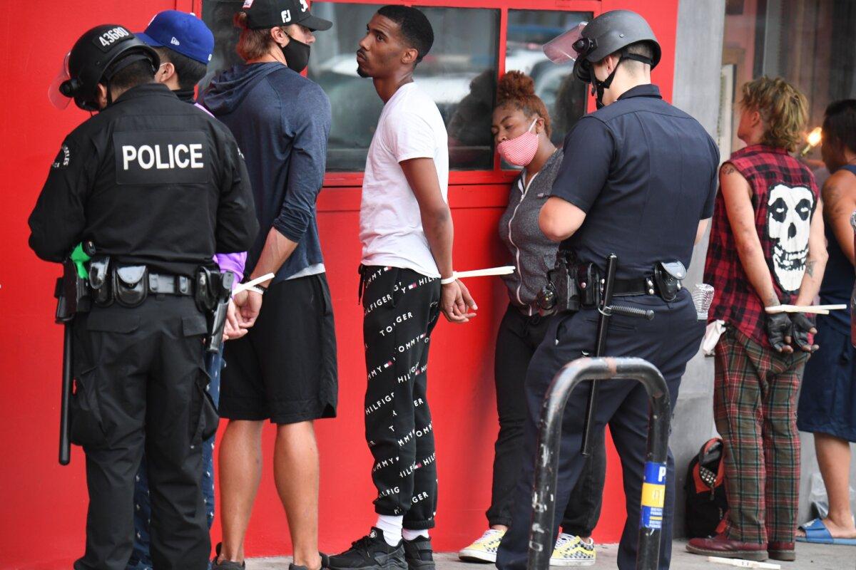 Arrests are made in Hollywood, Calif., on June 1, 2020, as a third night of curfews follows looting amid days of protests to decry George Floyd's death in Minneapolis. (Robyn Beck/AFP via Getty Images)