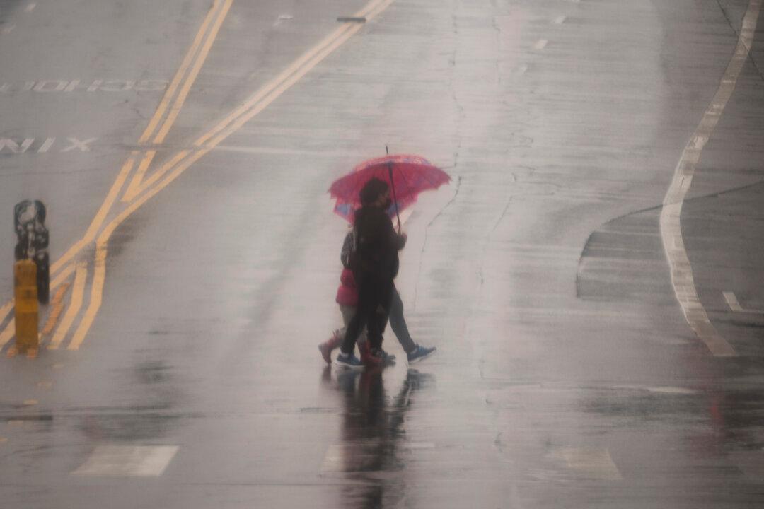 Wet Winter Storm Hits California, Closing Regional Airport and Trapping People in Swollen Rivers