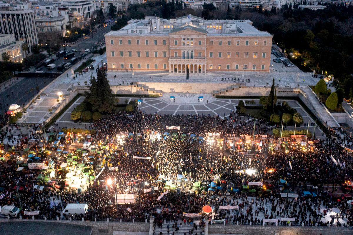 Greek farmers with their tractors take part in a protest to demand financial aid in front of the Parliament in Athens on Feb. 20, 2024. (Aris Messinis/AFP via Getty Images)