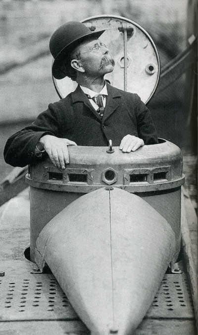 John Philip Holland, Irish-American inventor and engineer, stands in the hatch of one of his submarine creations. (Public Domain)