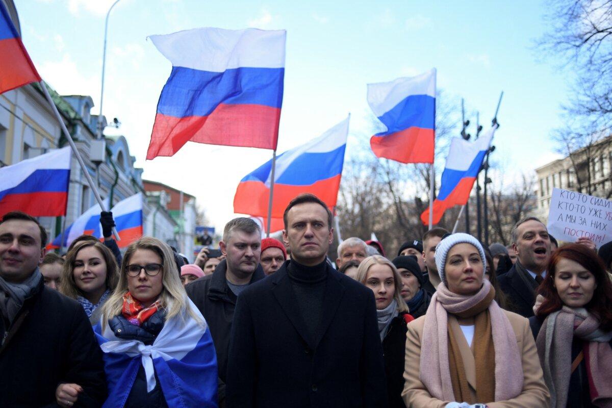 Russian opposition leader Alexei Navalny, his wife Yulia, opposition politician Lyubov Sobol, and other demonstrators march in memory of murdered Kremlin critic Boris Nemtsov in downtown Moscow on Feb. 29, 2020. (Kirill Kudryavtsev /AFP via Getty Images)