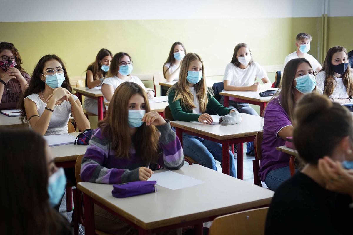 A photograph depicting how classrooms might have looked with students wearing masks during the pandemic in 2020. (Illustration - MikeDotta/Shutterstock)