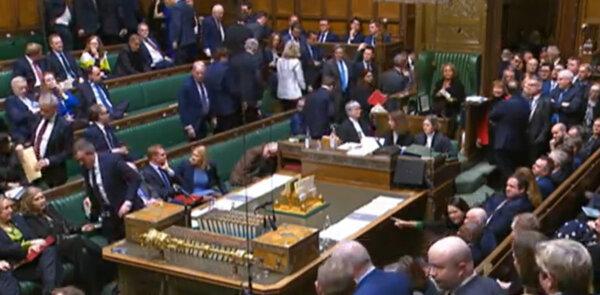 A screengrab of SNP and Conservative MPs walking out of the chamber of the House of Commons in London on Feb. 21, 2024. (UK Parliament/PA Wire)