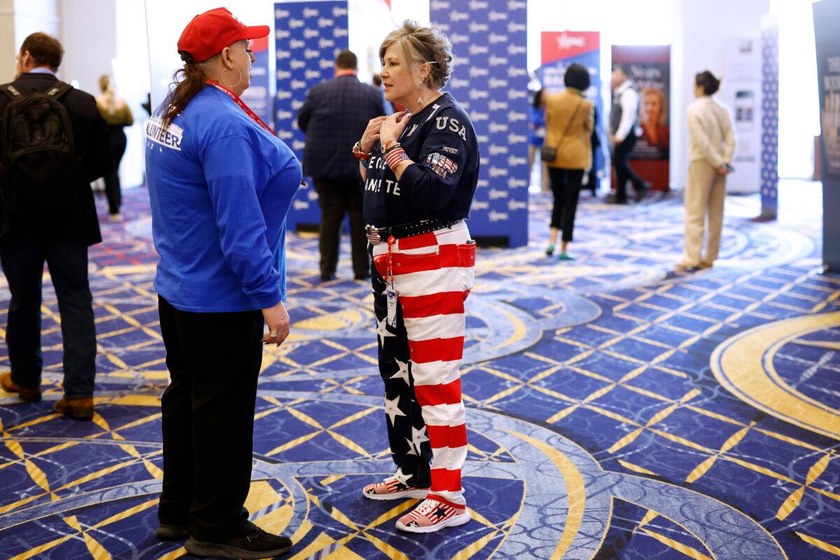 People walk around media row at the Conservative Political Action Conference (CPAC) at Gaylord National Resort Hotel And Convention Center in National Harbor, Md., on Feb. 22, 2024. (Anna Moneymaker/Getty Images)