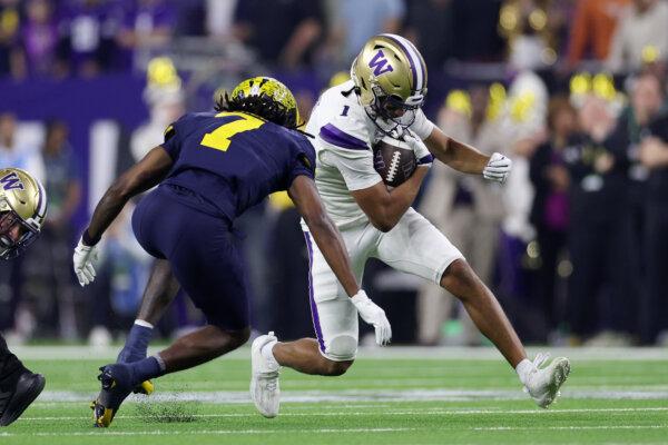 Rome Odunze #1 of the Washington Huskies runs the ball in the second quarter against the Michigan Wolverines during the 2024 CFP National Championship game at NRG Stadium in Houston, Texas, on Jan. 8, 2024. (Maddie Meyer/Getty Images)