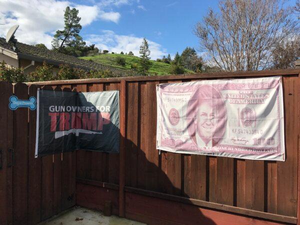 Trump flags on Mike Briard’s fence in Martinez Calif., on Feb. 6th, 2024. (Keegan Billings/The Epoch Times)