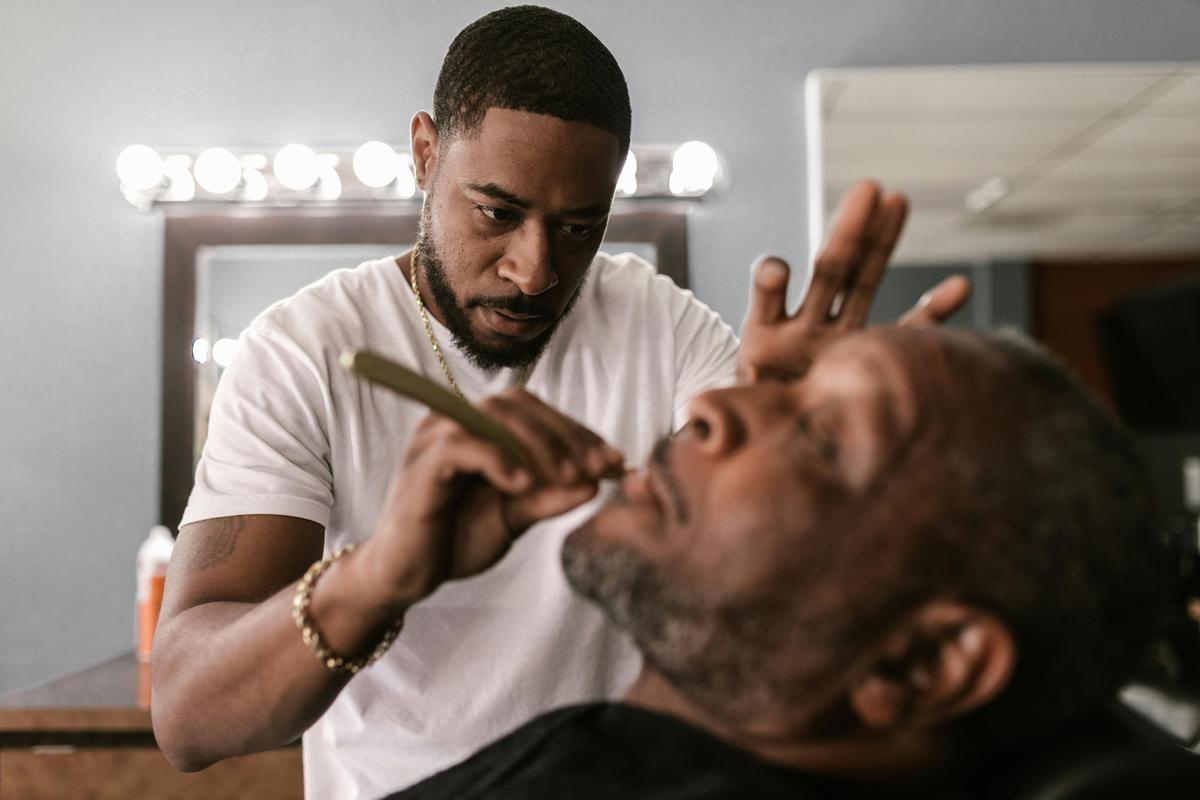For those who are hesitant about their first straight razor shave, using the services of a professional barber is a great way to enjoy the full experience. (RDNE Stock project/Pexels)