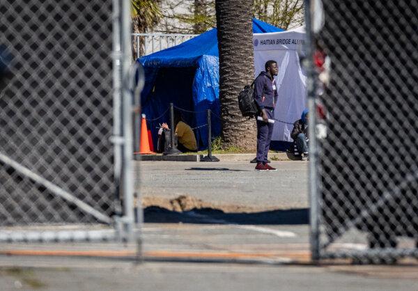 Illegal immigrants utilize shelter services provided by a nonprofit in San Diego on Feb. 22, 2024. (John Fredricks/The Epoch Times