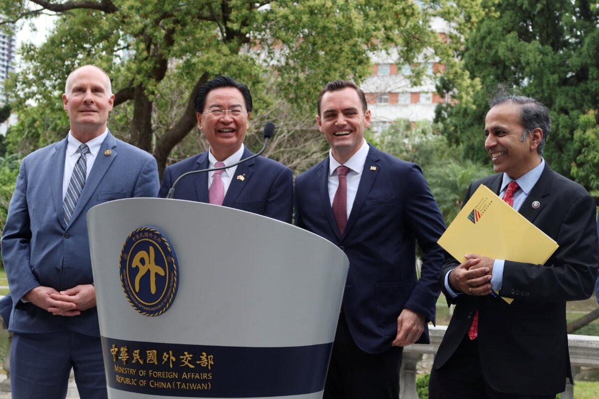 U.S. Representative Mike Gallagher (R-Wis.) attends a press conference with Taiwan Foreign Minister Joseph Wu, U.S. Rep. Raja Krishnamoorthi (D-Ill.), and U.S. Rep. John Moolenaar (R-Mich.) at Taipei Guest House in Taiwan on Feb. 22, 2024. (Ben Blanchard/Reuters)