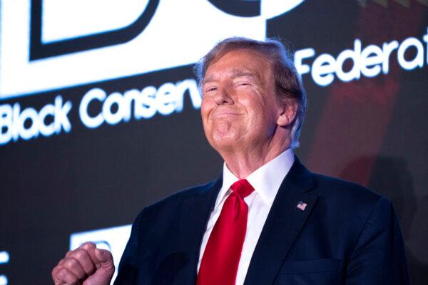 Former President Donald Trump raises his fist during the Black Conservative Federation Gala in Columbia, S.C., on Feb. 23, 2024. (Sean Rayford/Getty Images)