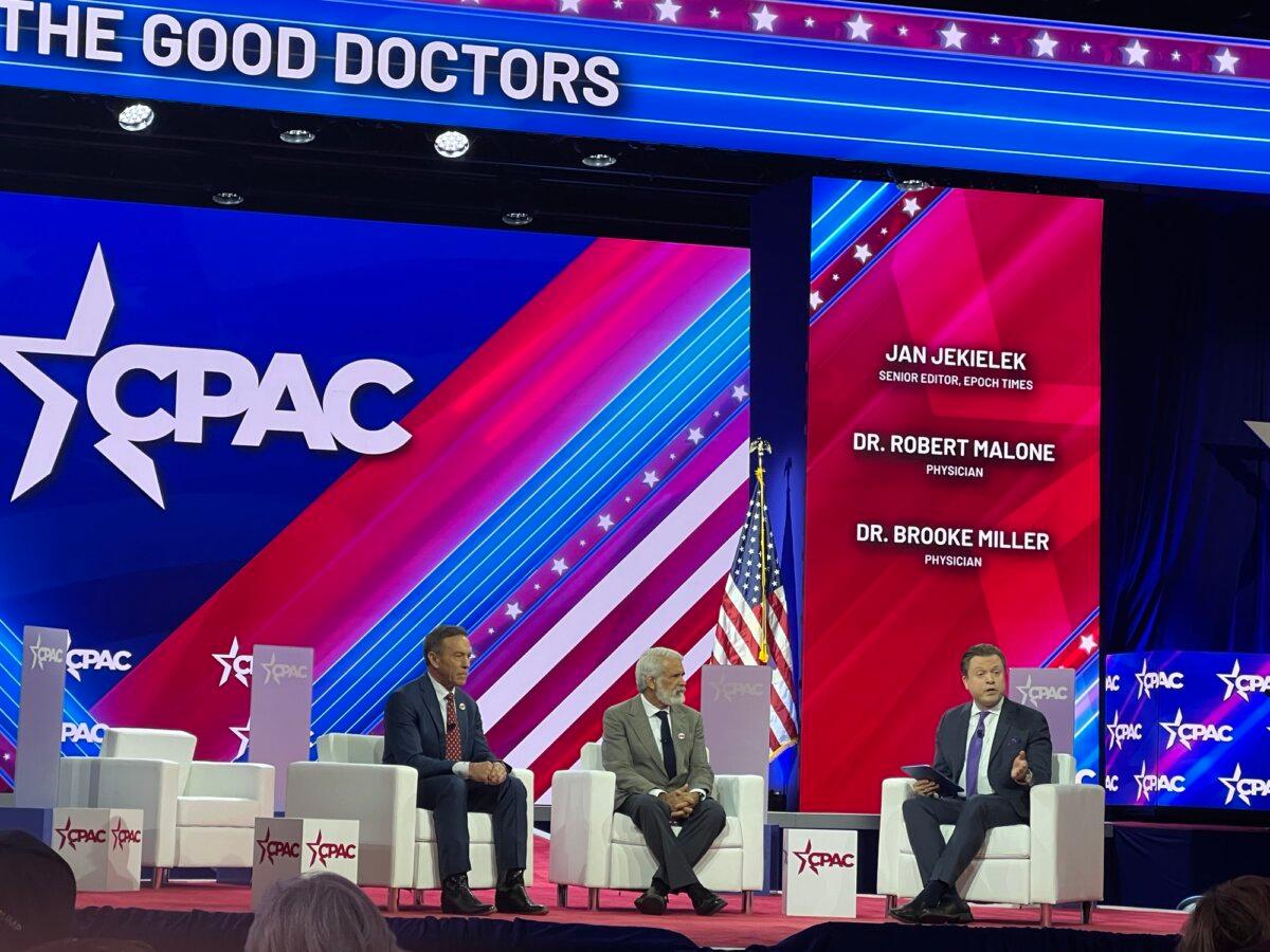 Epoch Times' senior editor Jan Jekielek (R) speaks on stage with Dr. Robert Malone (C) and Dr. Brooke Miller (C) in National Harbor, Md. on Feb. 24, 2024. (Janice The Epoch Times)