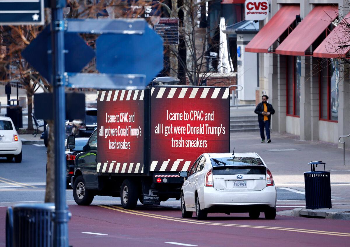 The Democratic National Committee sponsors a mobile billboard during Donald Trump's appearance at CPAC outside the Gaylord National Resort and Convention Center at National Harbor, Md., on Feb. 24, 2024.(Paul Morigi/Getty Images for DNC)